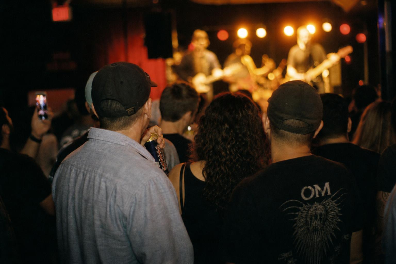 Friends together in the crowd at an intimate live concert